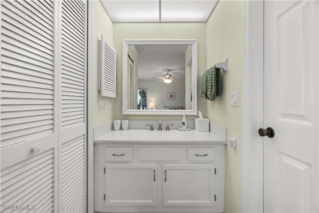 bathroom featuring ceiling fan and vanity