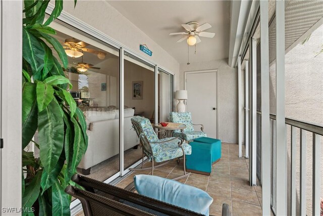 sunroom / solarium with ceiling fan