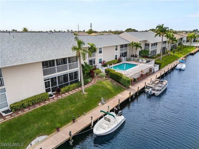 birds eye view of property with a water view