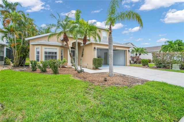 mediterranean / spanish home with a front yard and a garage