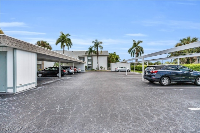 view of parking / parking lot with a carport