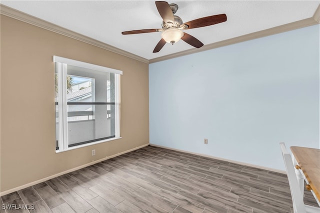 empty room featuring ceiling fan, hardwood / wood-style flooring, and crown molding