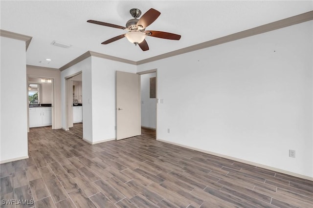 unfurnished living room with ornamental molding, hardwood / wood-style flooring, and ceiling fan