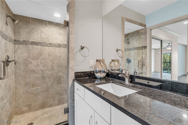 bathroom featuring vanity and an enclosed shower