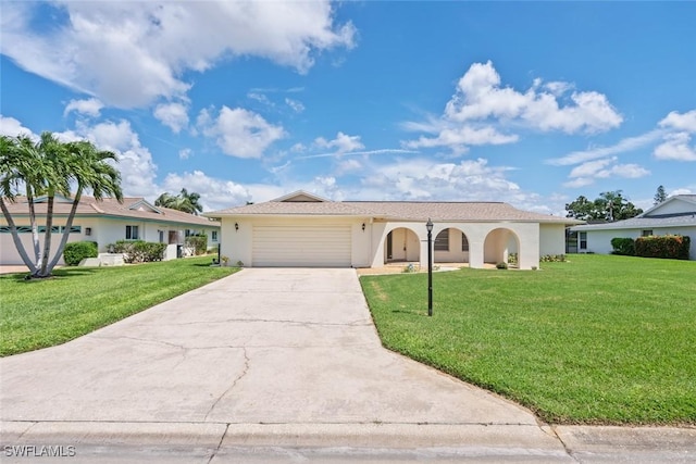 view of front facade with a garage and a front lawn