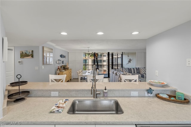 1401 Middle Gulf Dr Unit 301N, Sanibel, FL 33957 - kitchen with a sink, ornamental molding, and recessed lighting