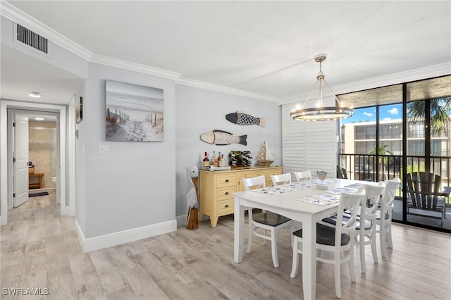 1401 Middle Gulf Dr Unit 301N, Sanibel, FL 33957 - dining room featuring light wood-style flooring, a notable chandelier, crown molding, and visible vents