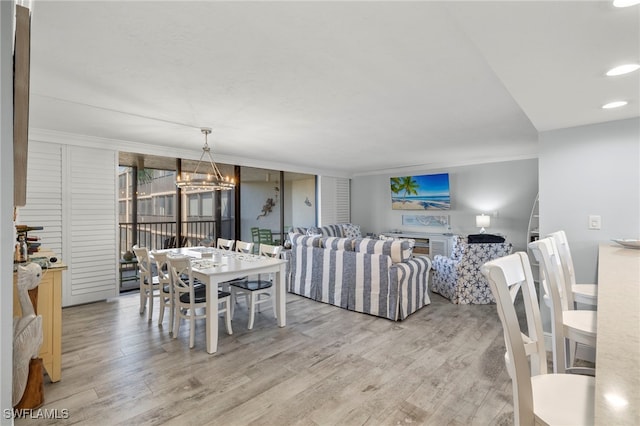 1401 Middle Gulf Dr Unit 301N, Sanibel, FL 33957 - dining space featuring ornamental molding, light wood-style flooring, and recessed lighting