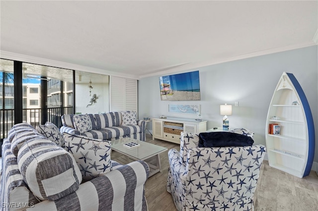 1401 Middle Gulf Dr Unit 301N, Sanibel, FL 33957 - living room featuring light wood finished floors and ornamental molding