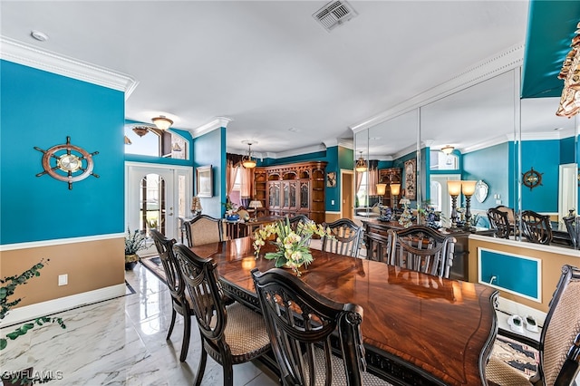 dining area with crown molding