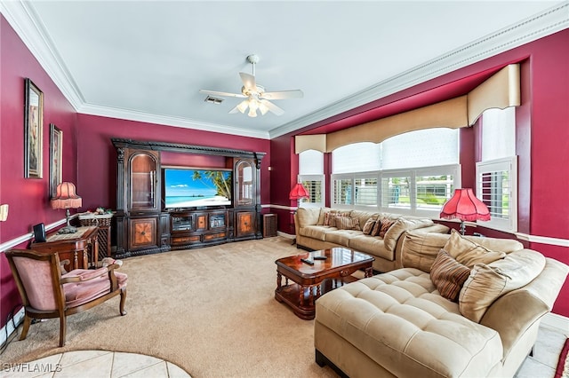 carpeted living room featuring ornamental molding and ceiling fan