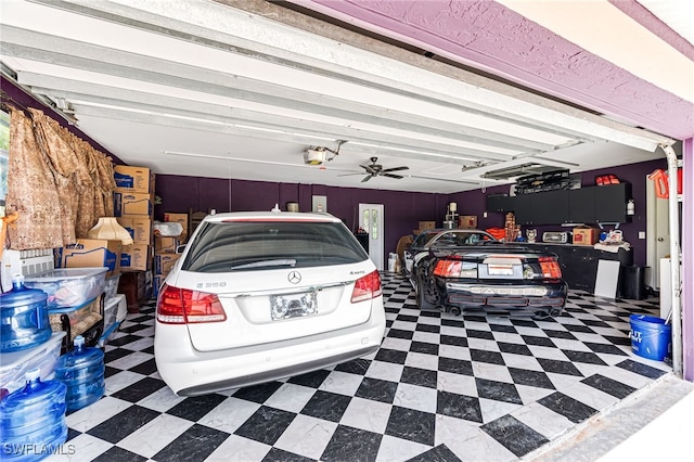 garage featuring a garage door opener and ceiling fan