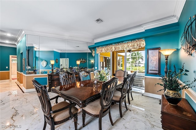 dining area with ornamental molding