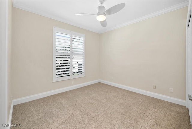 carpeted empty room with ceiling fan and ornamental molding