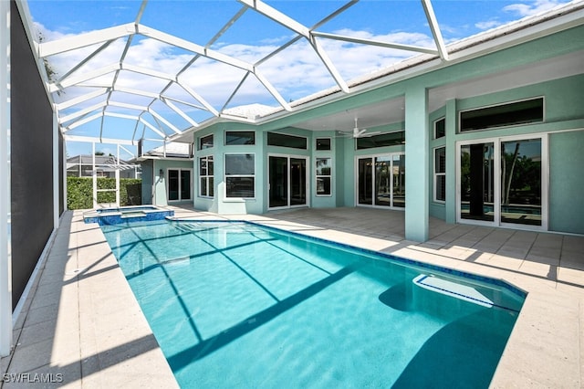 view of swimming pool with a lanai and a patio area