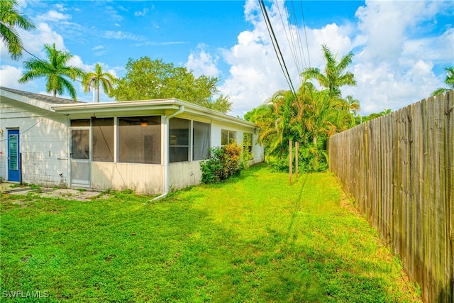 view of yard featuring a sunroom