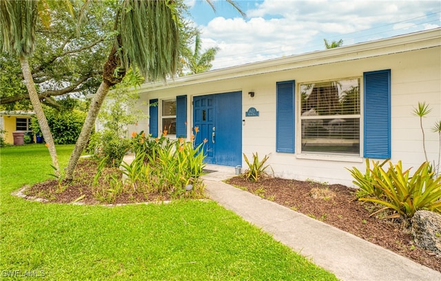 ranch-style home with a front yard