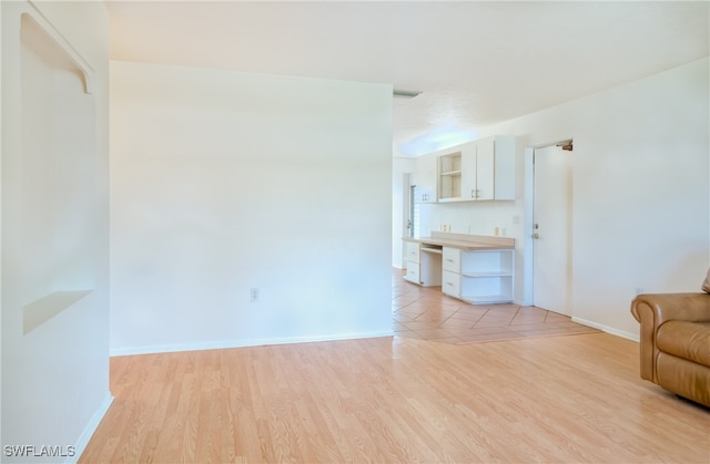 unfurnished living room featuring light tile patterned floors