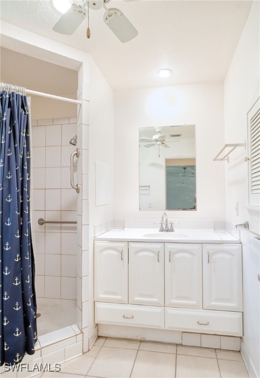 bathroom featuring a shower with curtain, tile patterned floors, vanity, and ceiling fan