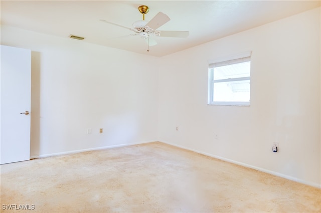 unfurnished room with carpet and ceiling fan