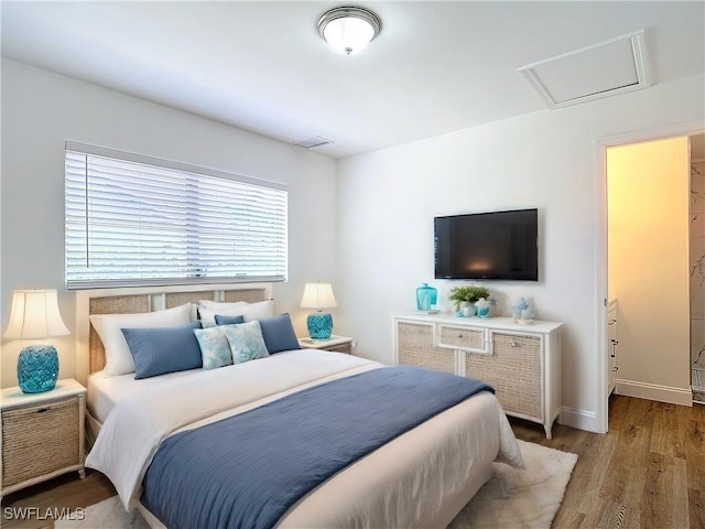 94 E N Shore Ave, North Fort Myers, FL 33917 - bedroom featuring wood finished floors and attic access