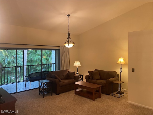 carpeted living room with lofted ceiling