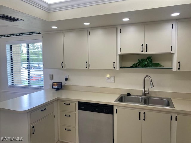 kitchen featuring light countertops, a sink, stainless steel dishwasher, and white cabinetry