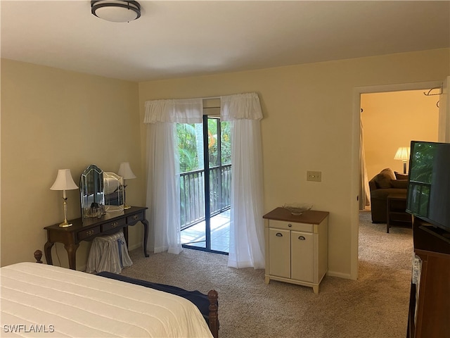 bedroom with access to outside and light colored carpet