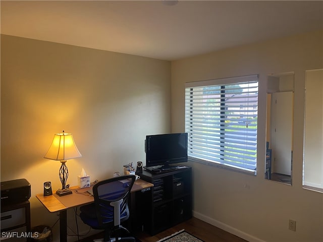 home office with hardwood / wood-style flooring