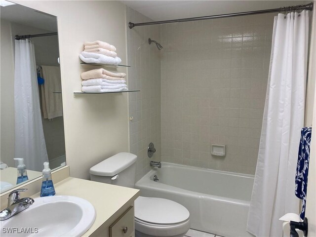 full bathroom featuring toilet, shower / bathtub combination with curtain, and vanity