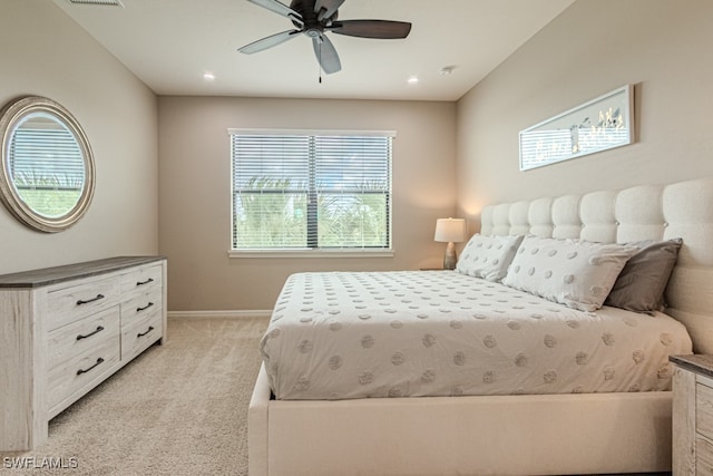 bedroom with ceiling fan and light colored carpet