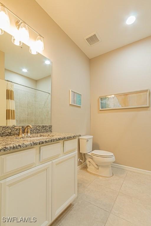 full bath featuring visible vents, baseboards, tile patterned flooring, and toilet