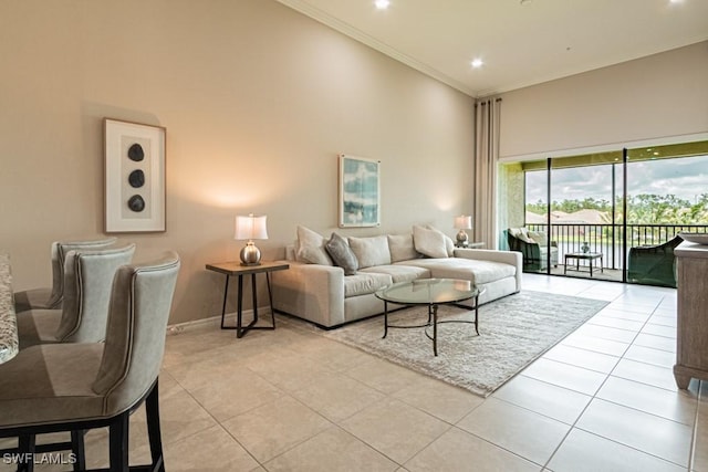 tiled living room with crown molding, recessed lighting, a high ceiling, and baseboards
