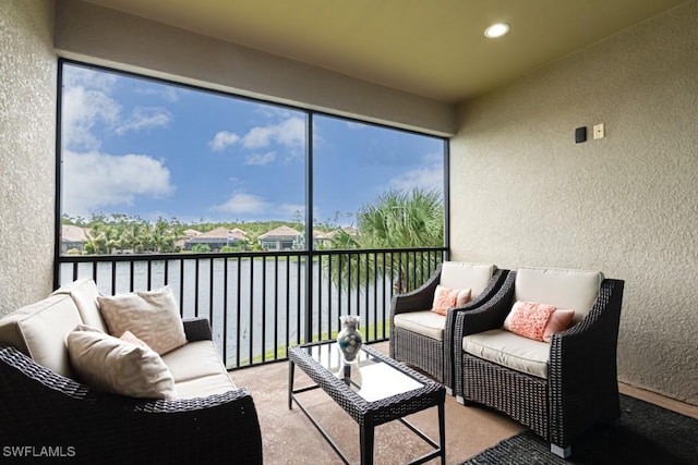 sunroom with a water view