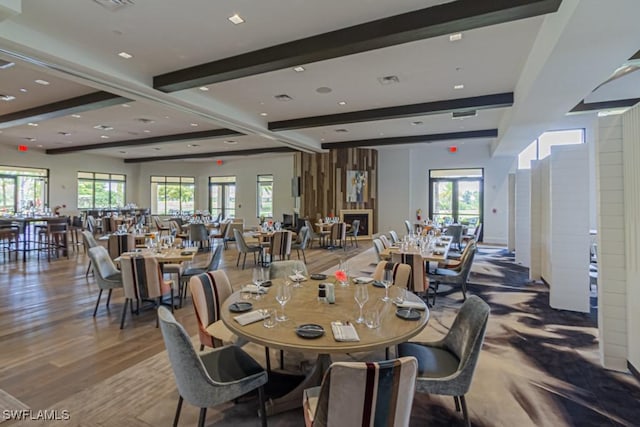 dining area featuring beamed ceiling, recessed lighting, wood finished floors, and visible vents