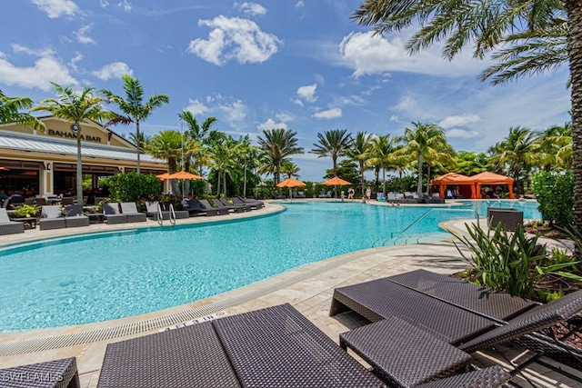 community pool featuring a gazebo and a patio