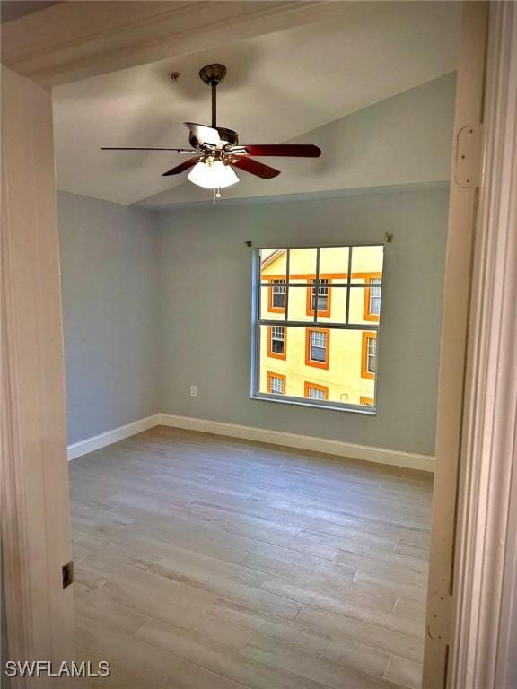 spare room featuring ceiling fan and light wood-type flooring