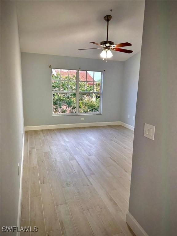 spare room featuring ceiling fan and light wood-type flooring