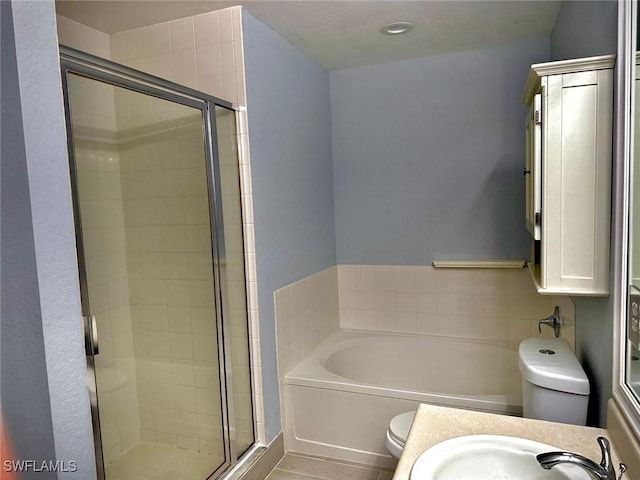 full bathroom with toilet, separate shower and tub, and sink