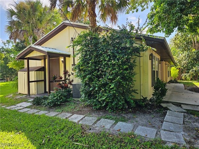 view of home's exterior featuring a storage shed