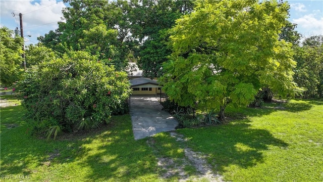 view of front of property with a garage and a front yard