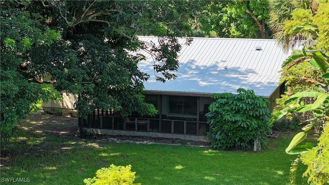 exterior space featuring a sunroom