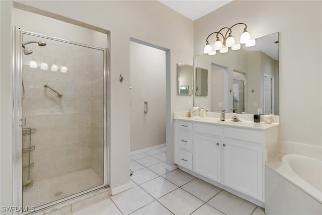 bathroom featuring tile patterned flooring, vanity, and separate shower and tub