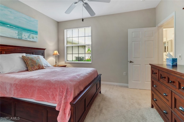 bedroom featuring light colored carpet and ceiling fan