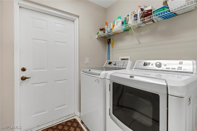 laundry area with washer and clothes dryer