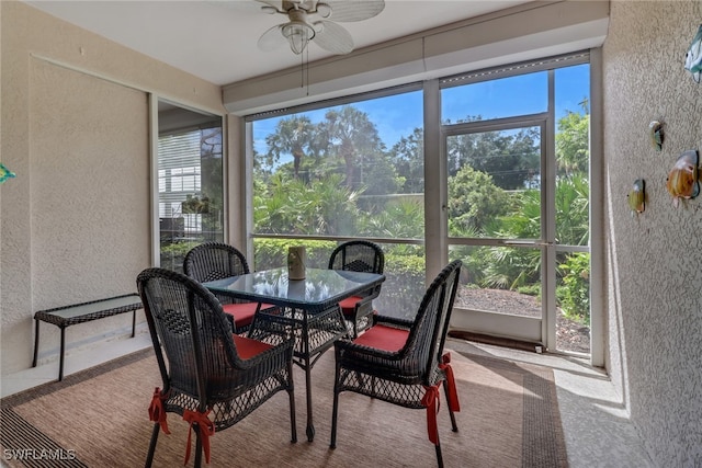 sunroom / solarium with a wealth of natural light and ceiling fan