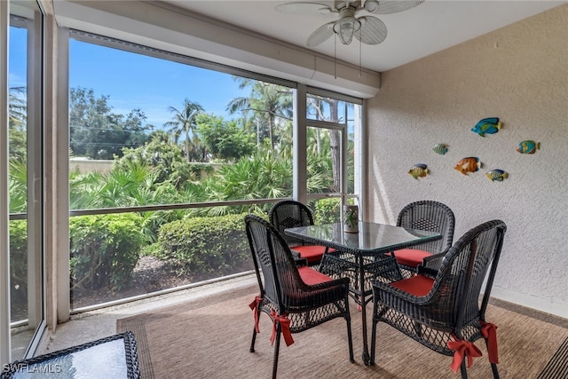 sunroom / solarium with ceiling fan and plenty of natural light