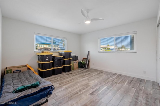 office space with ceiling fan and light wood-type flooring