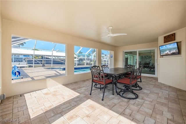 sunroom / solarium with ceiling fan