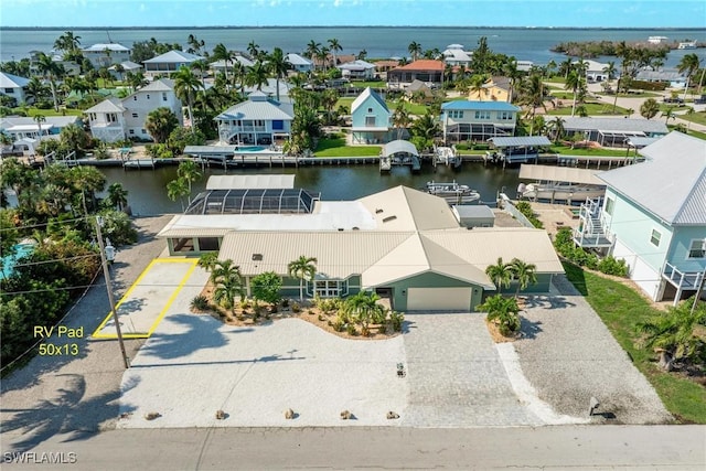 aerial view with a residential view and a water view